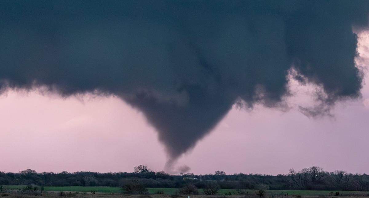 A tornado, illuminated by lightning, forms near Alta Vista in March. The storm mostly stayed over open country. Tornadoes have happened around Wichita this spring, but not in the city even though some predictions have said they were likely.