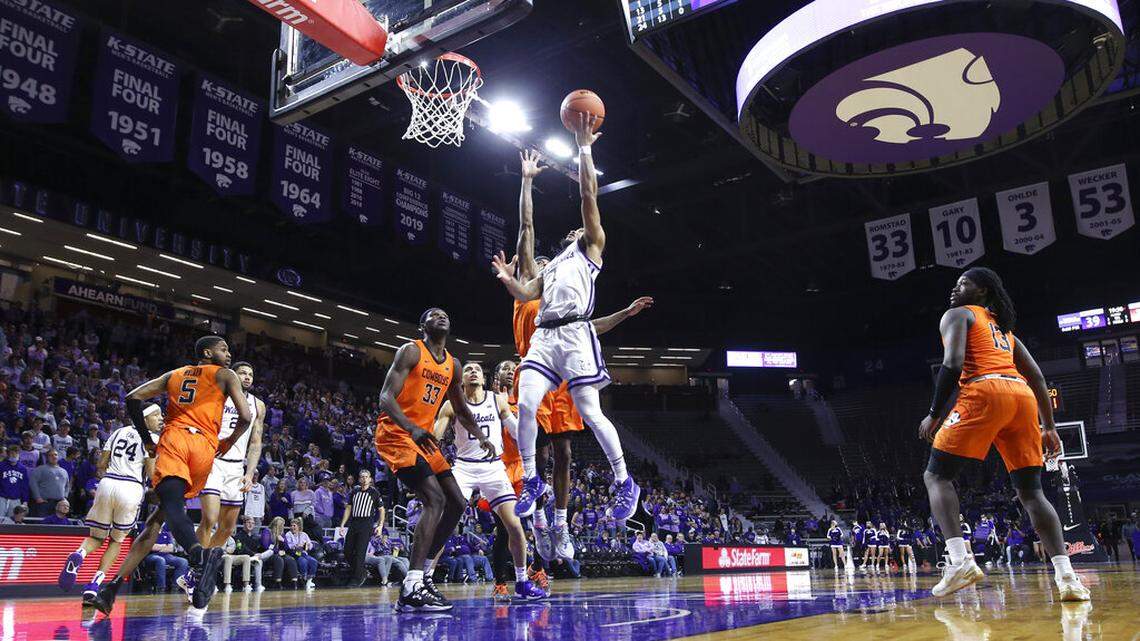 Kansas State guard Markquis Nowell (1) goes up to the basket against the Oklahoma State defense during the second half of an NCAA college basketball game on Wednesday, Feb. 2, 2022, at Bramlage Coliseum in Manhattan, Kan. Kansas State defeated Oklahoma State, 71-68. (AP Photo/Nick Krug)