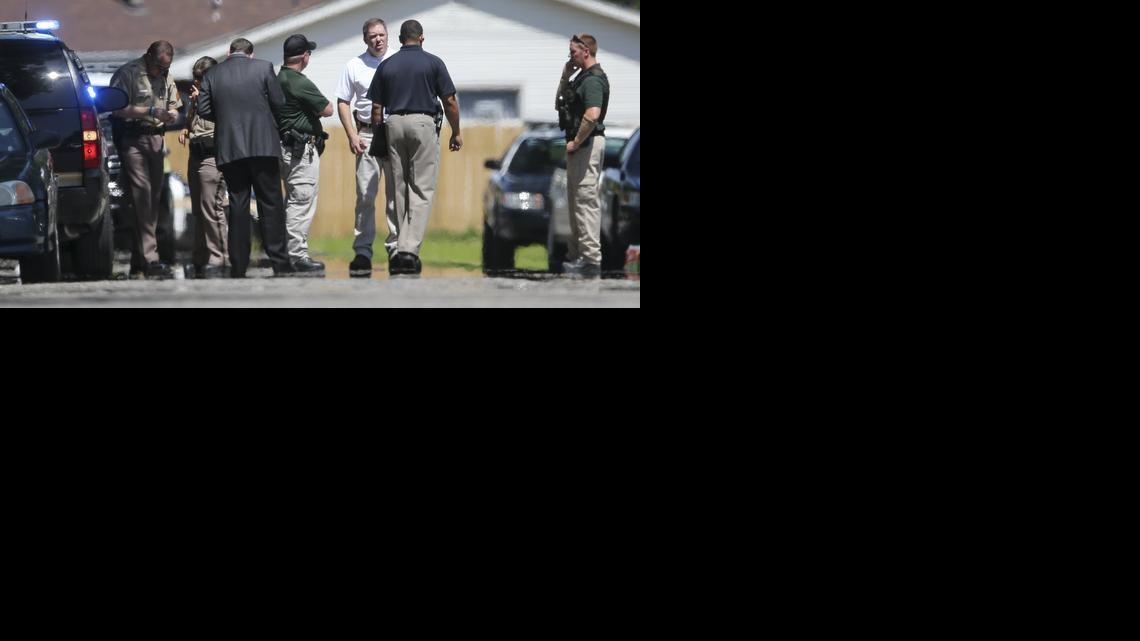 Police investigate the scene where a police-involved shooting took place Friday near Lincoln and Rock Road. (July 4, 2014)

