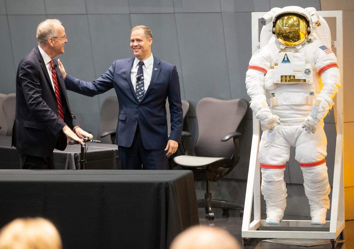 U.S. Sen. Jerry Moran, left, introduces NASA Administrator Jim Bridenstine at an event commemorating the 50th anniversary of the moon landing at the National Center for Aviation Training in July 2019.