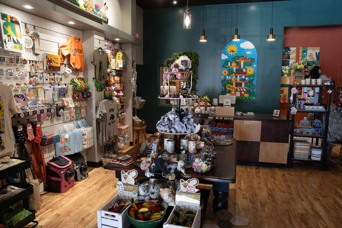 Noah Souza and Julia Hardenburger have opened Wichita’s first cat cafe at the Shops at Tallgrass called Snick’s Cat Cafe. In addition to coffee and pastries they also sell a large selection of cat merchandise some of which is made by local artists.