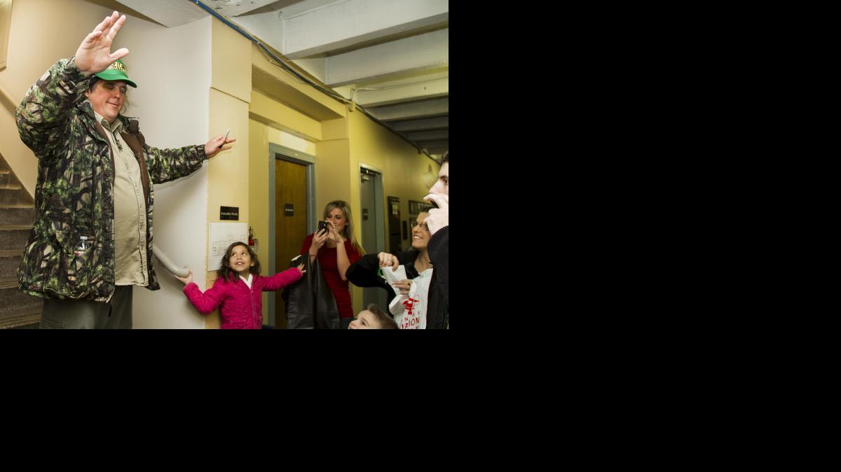 James “Bobo” Fay, one of the four cast members of the popular Animal Planet show “Finding Bigfoot,” greets his fans after filming a town hall meeting at the Kansas Aviation Museum. (1/26/2013)