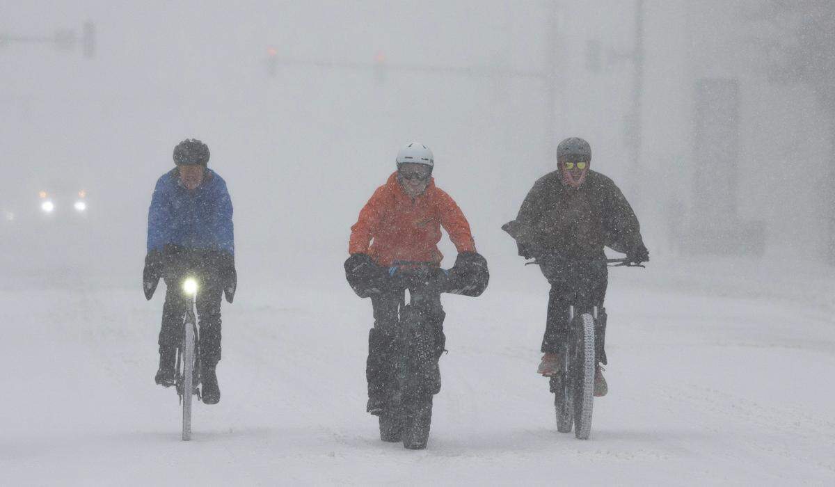 Cyclists ride through Wichita during the weekend’s severe winter storm. If this is your idea of fun, you’ll love the city’s new bike master plan.