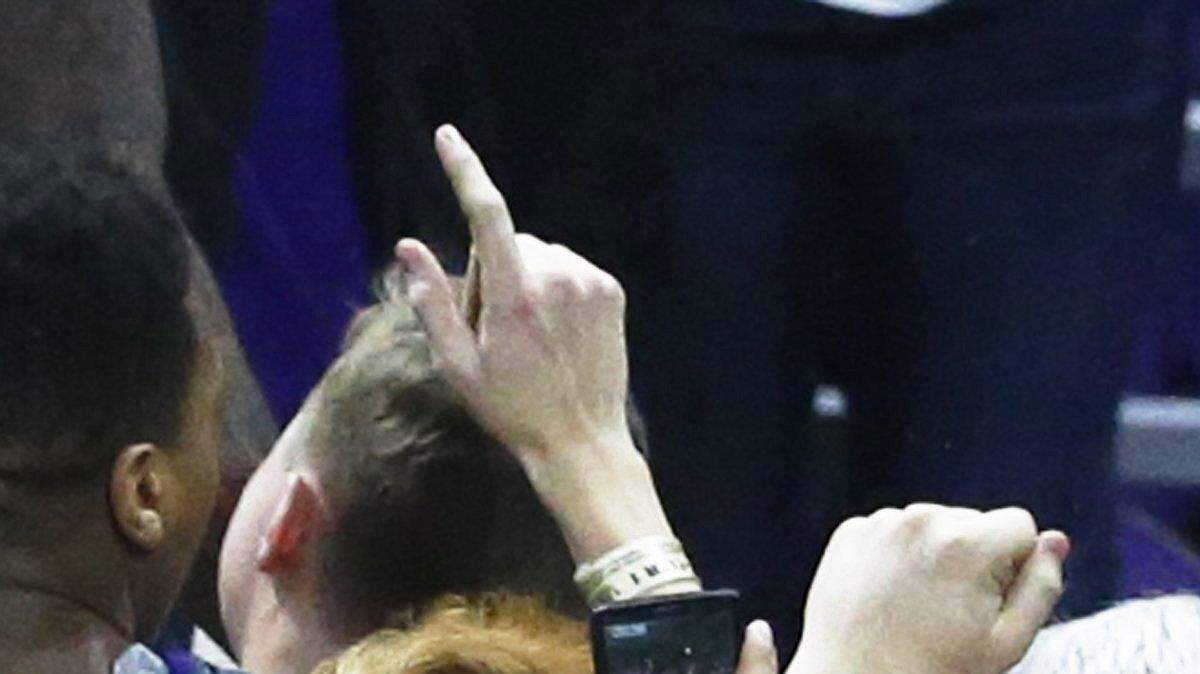 Kansas State fans take to the court after the Wildcats beat Kansas in 2015.