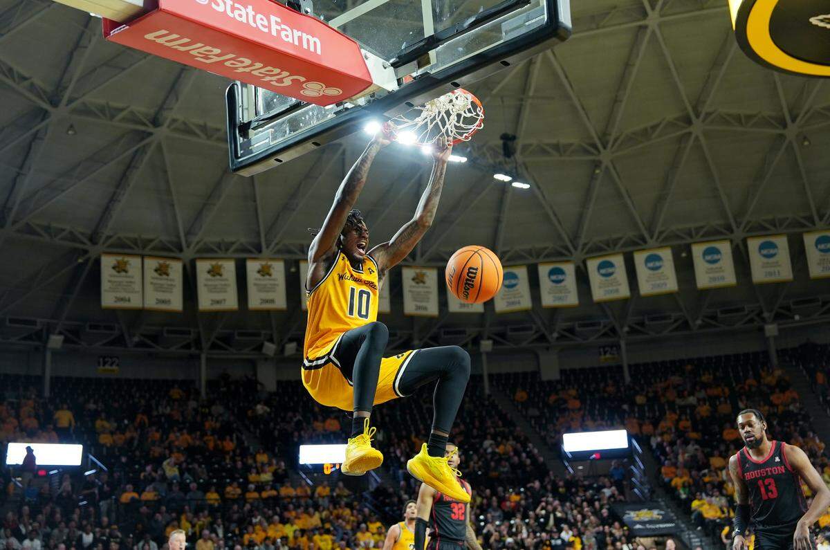 Wichita State University’s Jaykwon Walton dunks the ball in the first half against the University of Houston during their game at Koch Arena.