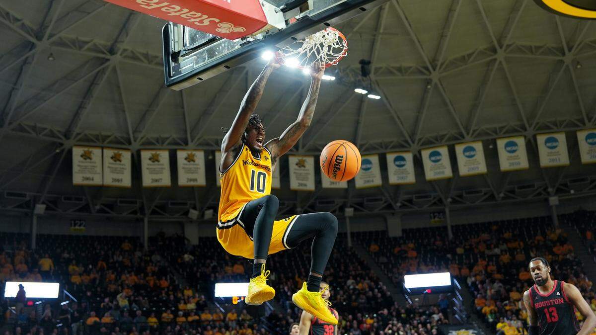 Wichita State University’s Jaykwon Walton dunks the ball in the first half against the University of Houston during their game at Koch Arena.