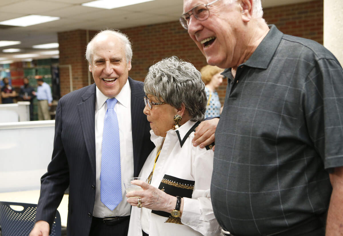 In this 2014 photo, Dan Glickman poses with Jo Brown and Gary Pottorff during a reception in Glickman's honor. The three served on the school board together decades earlier.