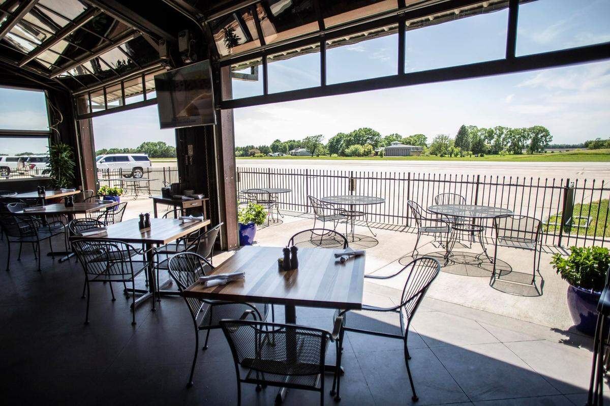The patio at Benton’s Stearman Field Bar & Grill is a popular place to dine and watch airplanes fly in.