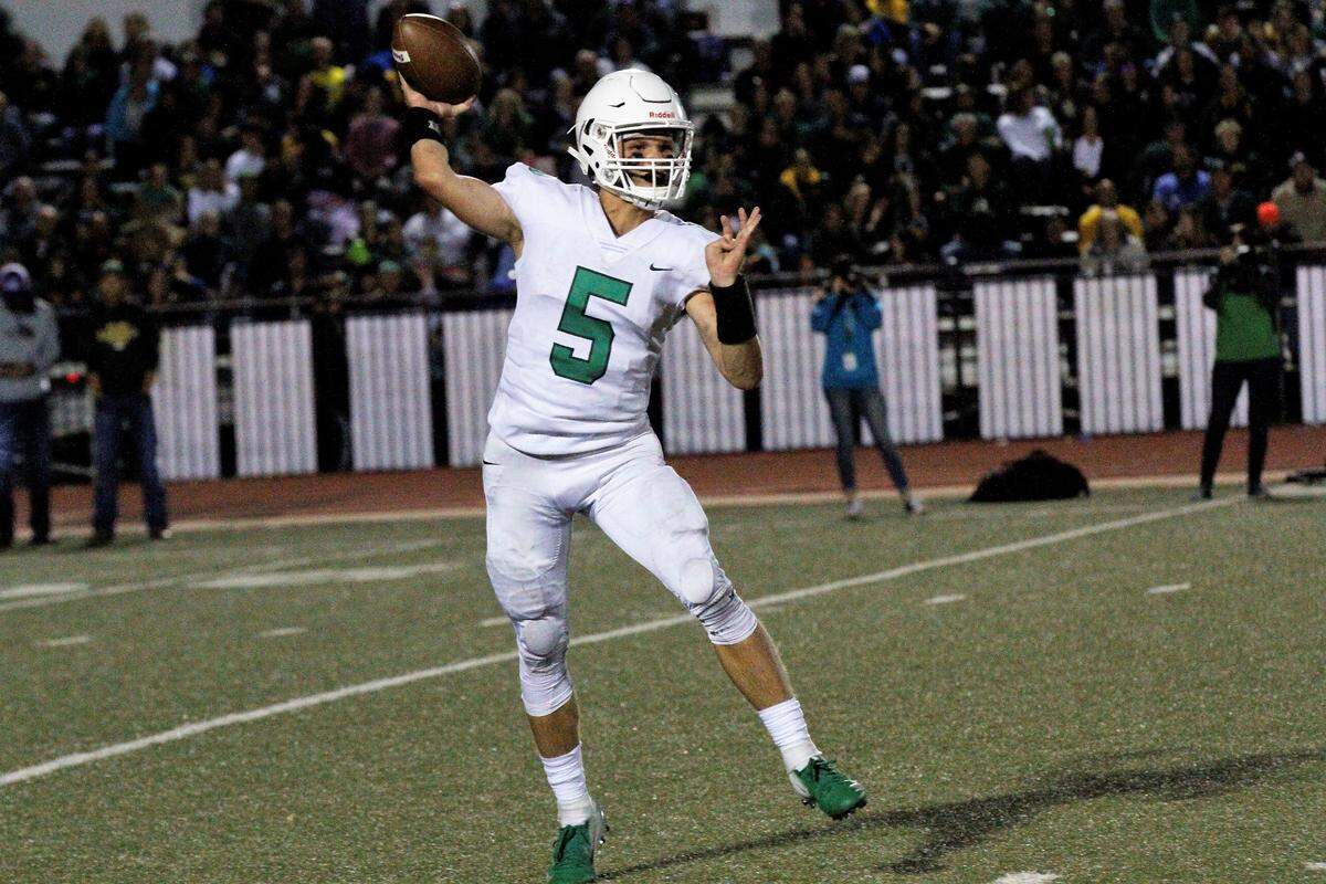 Derby senior Hunter Igo was forced into quarterback duties after starter Grant Adler was injured in the Panthers’ 24-6 win at Bishop Carroll on Friday. (Sept. 21, 2018)