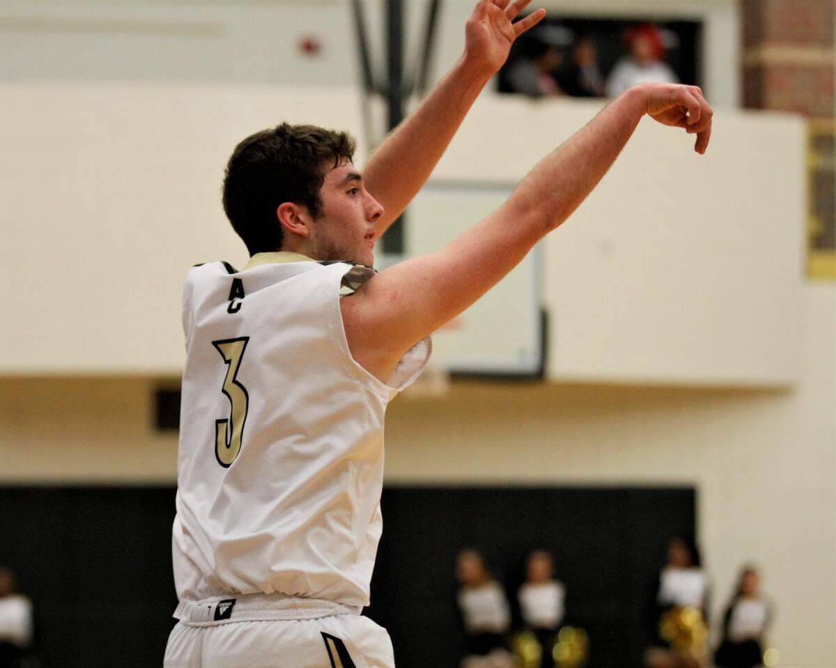 Andover Central senior guard Easton Leedom fires a three-pointer during the Jaguars’ 82-72 overtime loss to Wichita Southeast on day one of the AVCTL/GWAL Challenge. (Jan. 10, 2019)