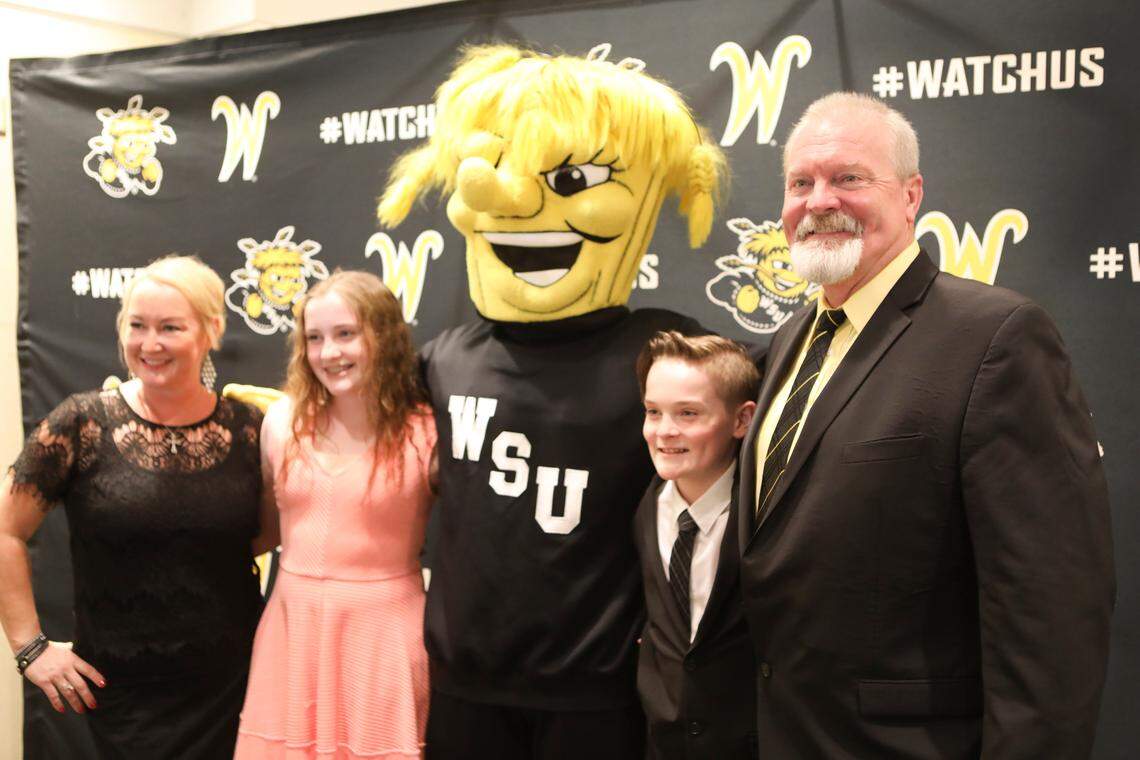 New Wichita State University baseball coach Eric Wedge poses with his family during his first appearance as the new WSU baseball coach.