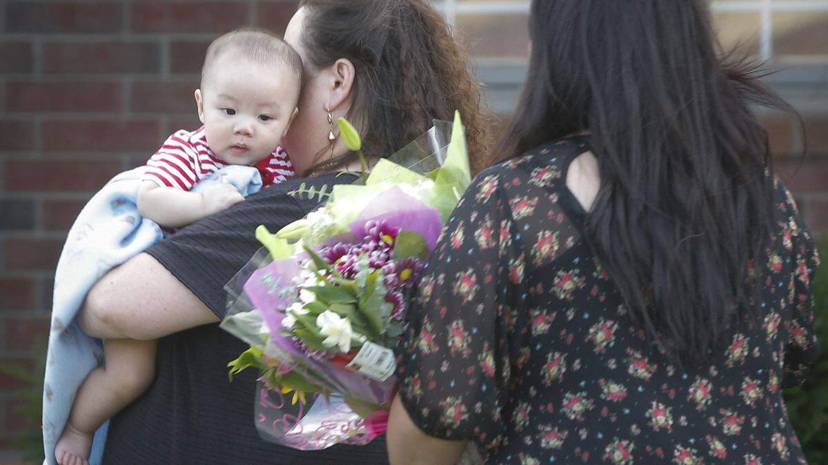 The infant son of two homicide victims is held by his grandmother, Le Pham, during a vigil to honor his parents and grandmother in 2014. The vigil was for Tuyet Huynh, 45, her daughter Trinh Pham, 20, and her future son-in-law, Sean Pham, 21. The baby was asleep at the time and was not hurt in the shooting, which occurred shortly after midnight on June 24, 2014. Huynh’s boyfriend, Vinh Van Nguyen, was arrested and charged with capital murder.