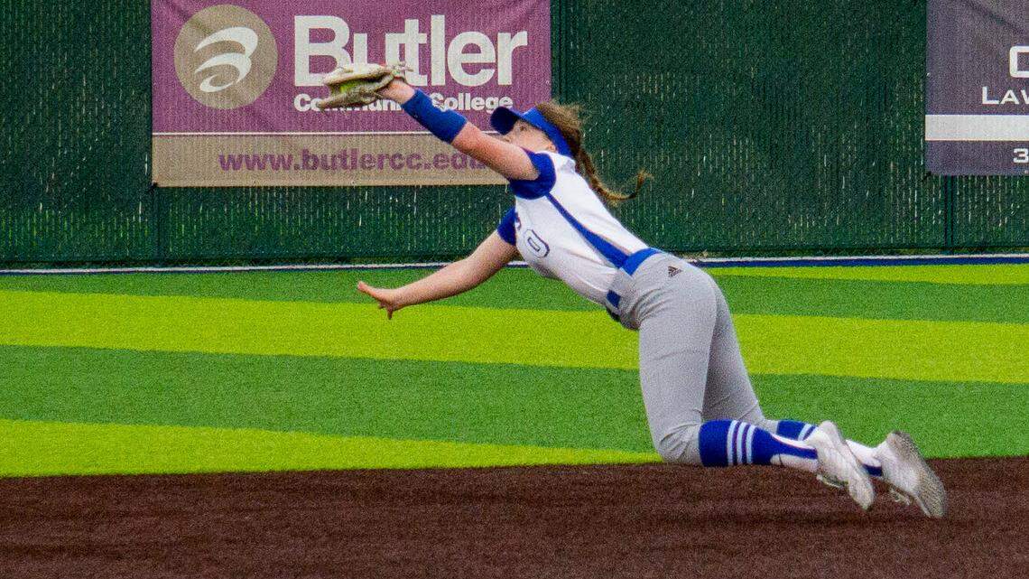 Andover freshman Grace Boling makes a diving grab in a game earlier this season in a win over Arkansas City. The Trojans are 10-0 so far this season.