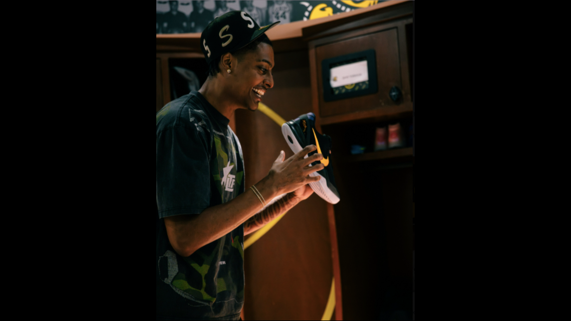 Wichita State men’s basketball player Jaret Valencia smiles upon receiving his new pair of Nike shoes ahead of the 2025-26 season.