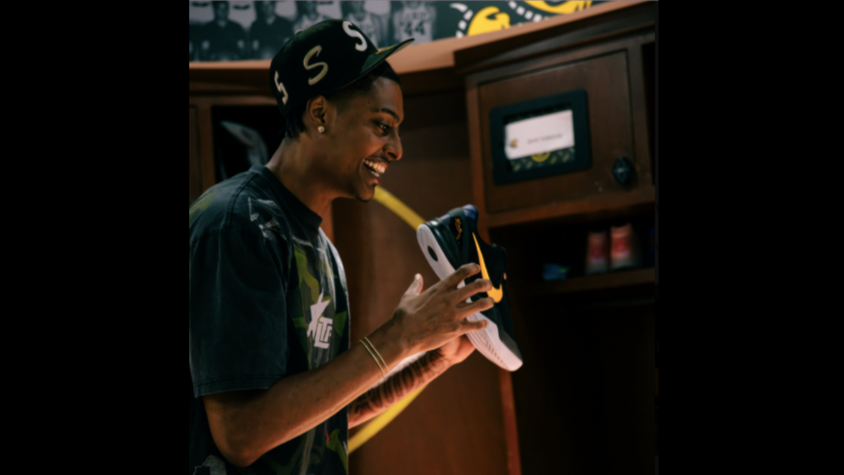 Wichita State men’s basketball player Jaret Valencia smiles upon receiving his new pair of Nike shoes ahead of the 2025-26 season.