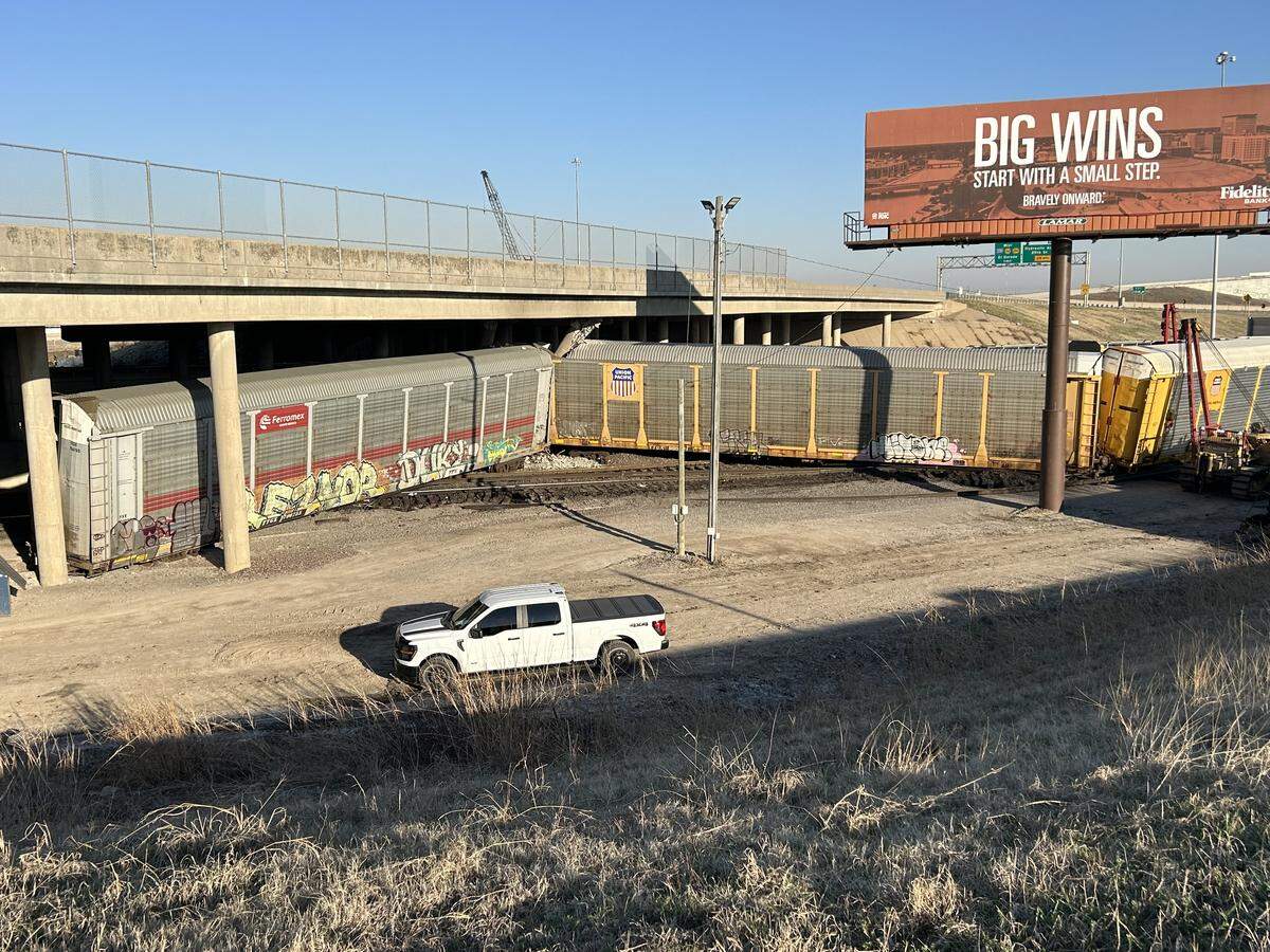 This photo from the Kansas Department of Transportation shows cleanup and inspections underway after a train derailment damaged I-135 bridge columns on March 20.