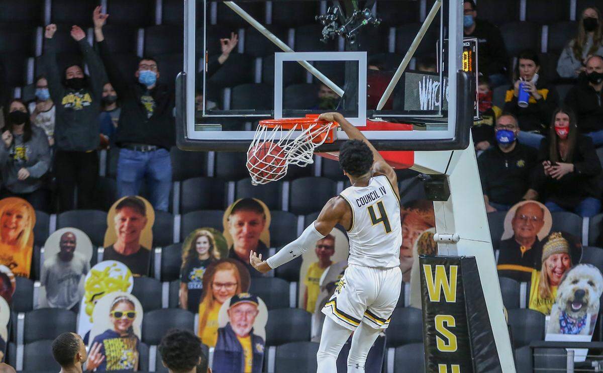 Wichita State’s Ricky Council IV throws down a dunk against Cincinnati on Sunday at Koch Arena.