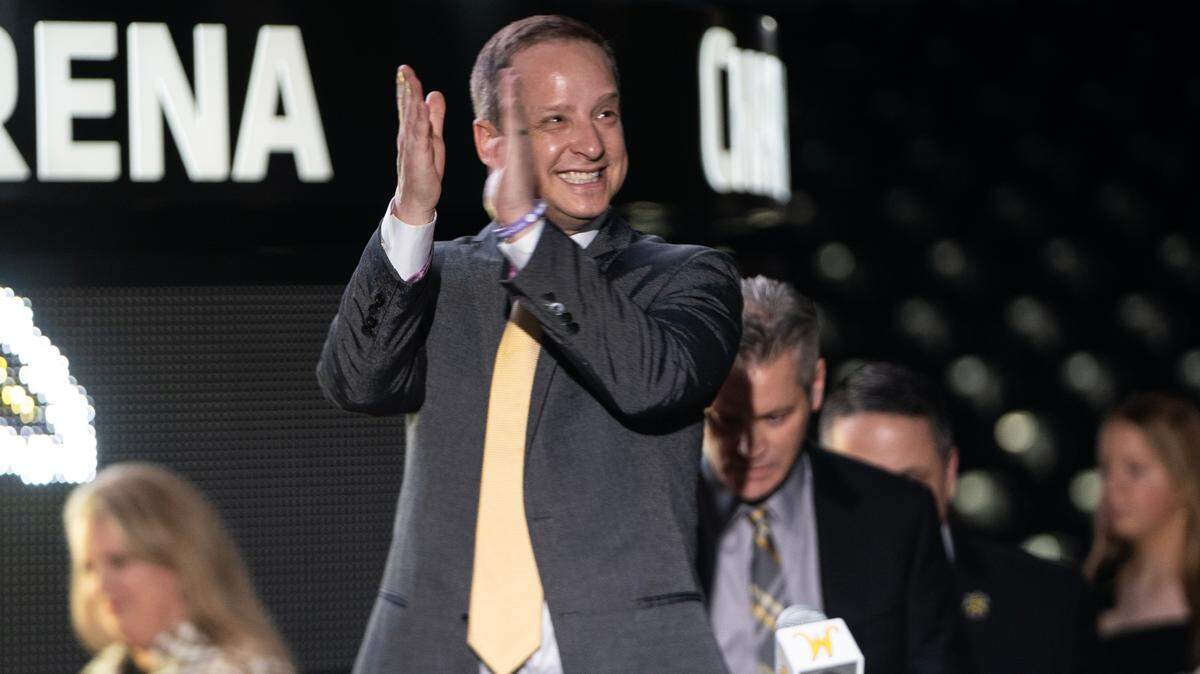 New Wichita State basketball coach Paul Mills walks onto the stage during a ceremony at Koch Arena.