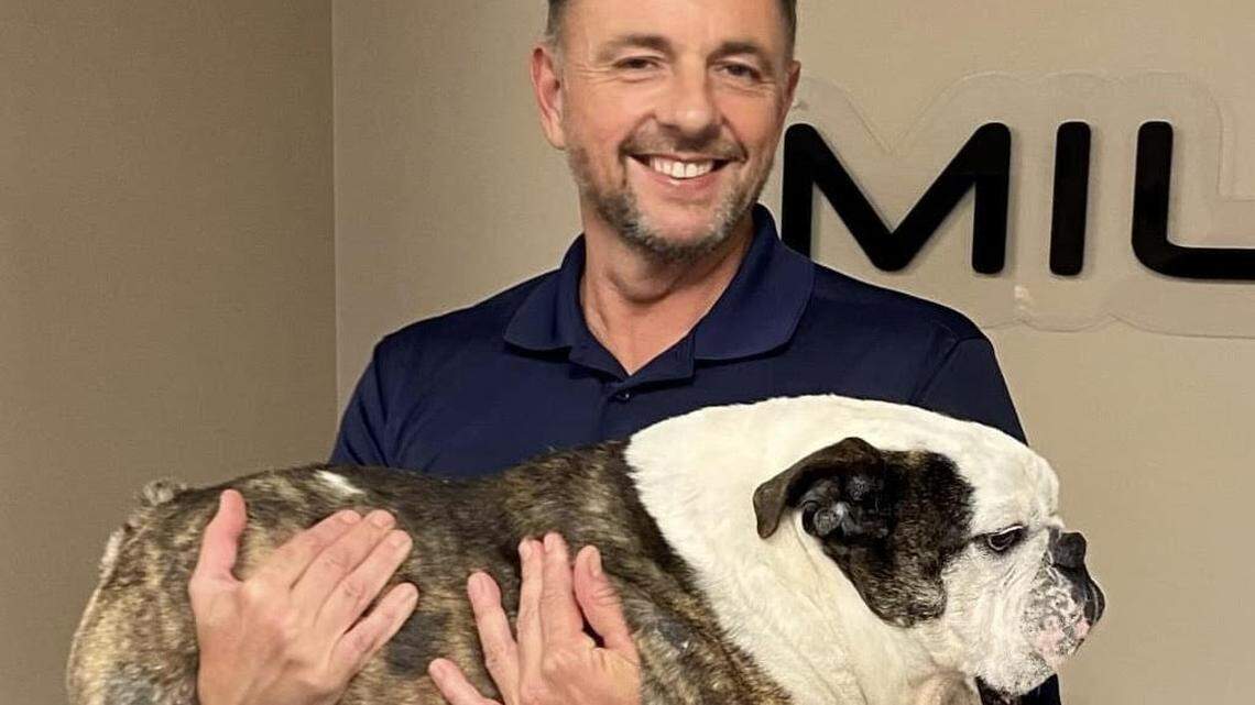 Jeff Tucker, shown with his English bulldog, Ghillie, is opening Barktopia in northwest Wichita next month.