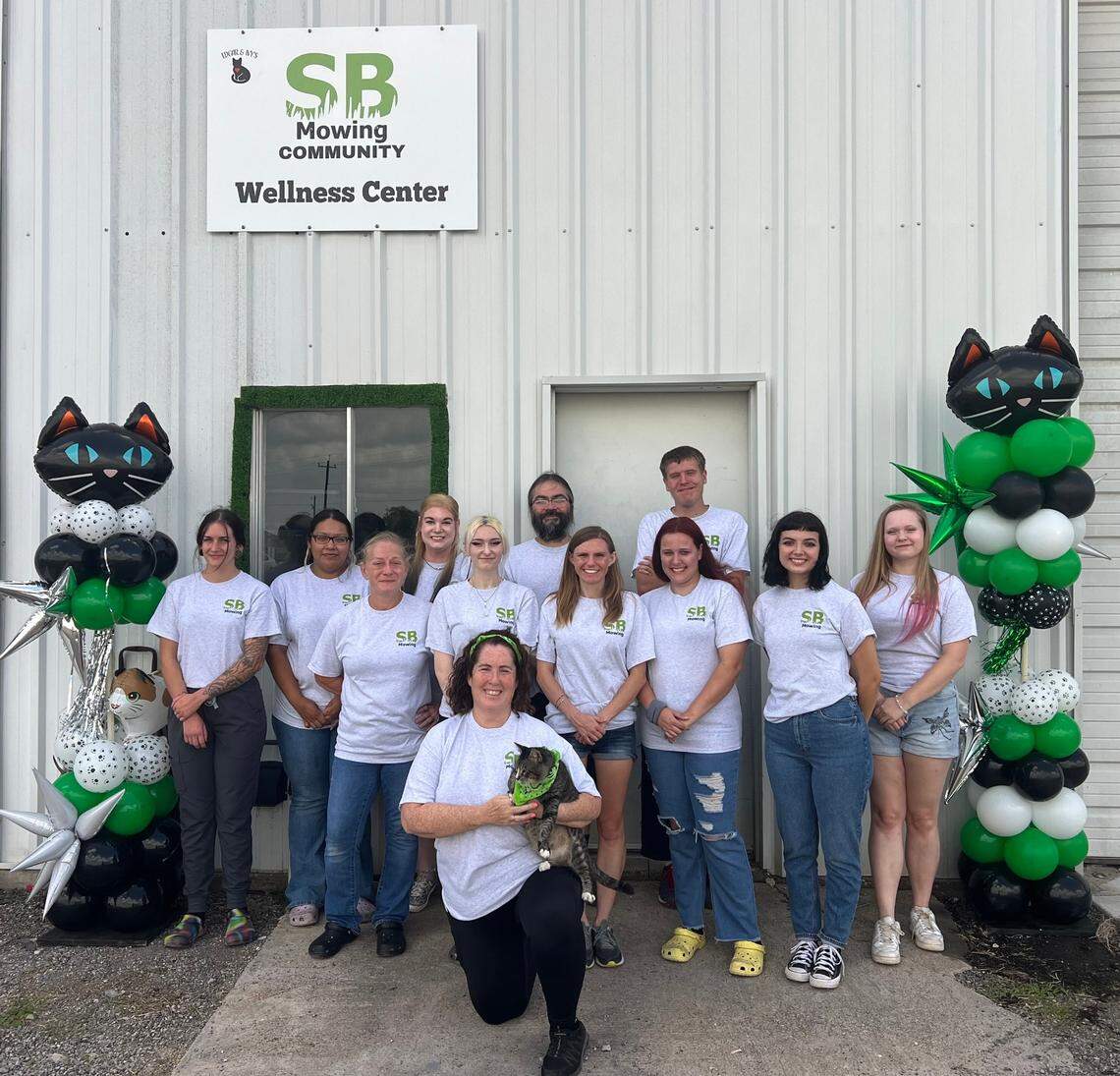Edgar and Ivy’s Cat Sanctuary owner Anissa Beal holds Esbee, the cat she helped rescue, who in turn helped rescue the sanctuary. On Friday, Beal and her staff celebrated the opening of their new SB Mowing Community Wellness Center, which is named for Wichita businessman Spencer, who owns SB Mowing, and his followers who helped raise money for the center and the sanctuary.