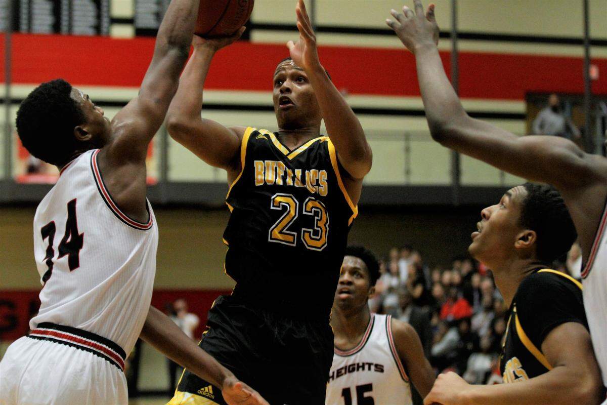 Wichita Southeast’s Micah Jacques shoots a fadeaway during the Buffaloes’ loss to Wichita Heights earlier this season.