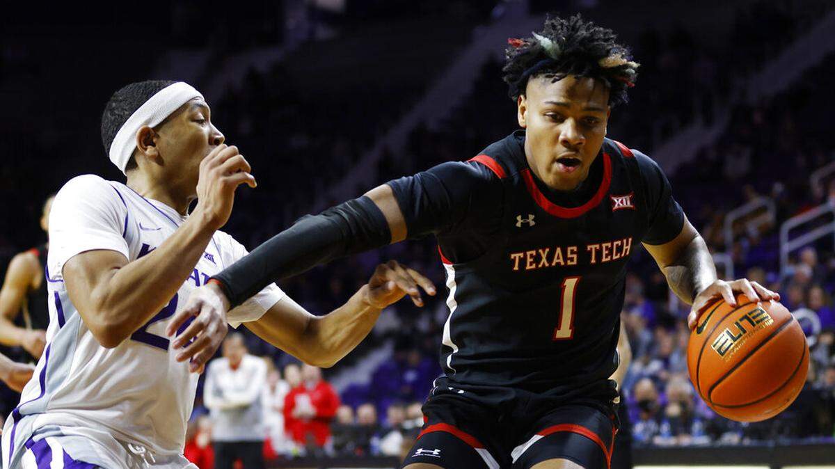 Texas Tech guard Terrence Shannon Jr. (1) attempts to get past Kansas State guard Nijel Pack (24) during the first half of an NCAA college basketball game on Saturday, Jan. 15, 2022, in Manhattan, Kan. (AP Photo/Colin E. Braley)