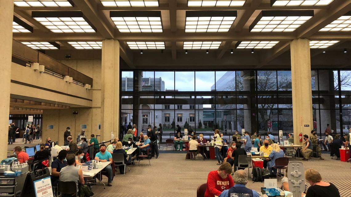 People are vaccinated for COVID-19 inside the former downtown public library. (April 6, 2021)
