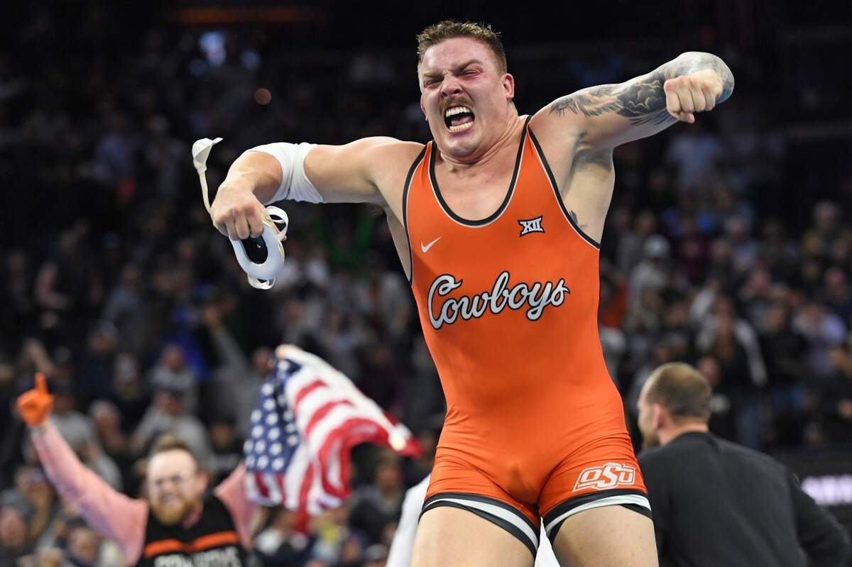 Newton native Wyatt Hendrickson, a senior for Oklahoma State, celebrates after defeating Minnesota’s Gable Steveson to become a national champion at the NCAA Men’s Wrestling Championship in Philadelphia.
