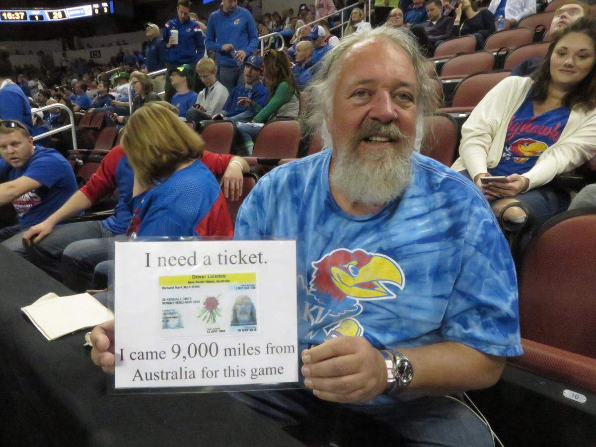 Mark Matthews shows the sign that got him a ticket to Saturday's KU-Seton Hall game.