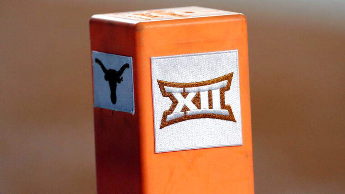 FILE - In this Sept. 15, 2018, file photo, the Big 12 conference logo is seen on a pylon during the first half of an NCAA college football game between Texas and USC in Austin, Texas. Texas and Oklahoma made a request Tuesday, July 27, 2021, to join the Southeastern Conference — in 2025 —- with SEC Commissioner Greg Sankey saying the league would consider it in the “near future.” (AP Photo/Eric Gay, File)