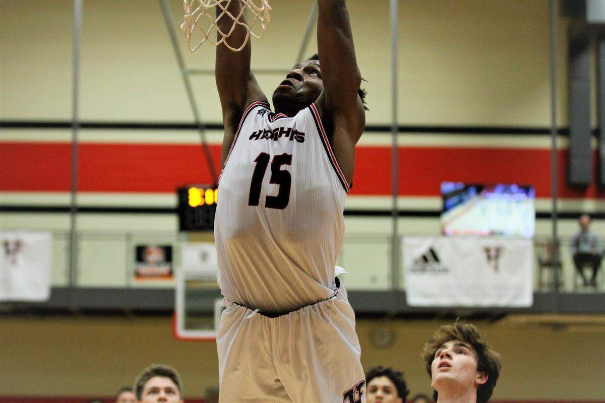 Wichita Heights’ Jaxon Pillich goes up for a dunk during the Falcons’ 61-46 home loss to Bishop Carroll on Tuesday night. (Jan. 8, 2019)