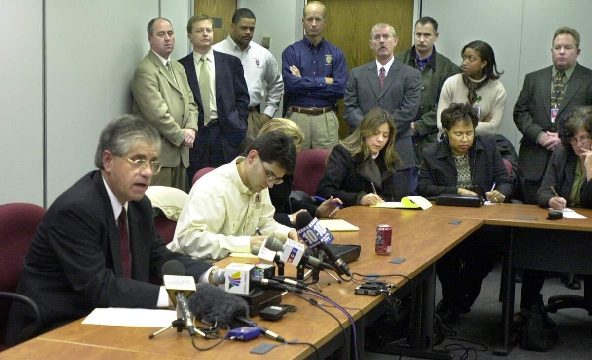 Surrounded by reporters and police officials, Wichita police homicide Lt. Ken Landwehr reads a statement during a news conference, describing information provided in recent letters from serial killer BTK of people and events in his past. (November 30, 2004)