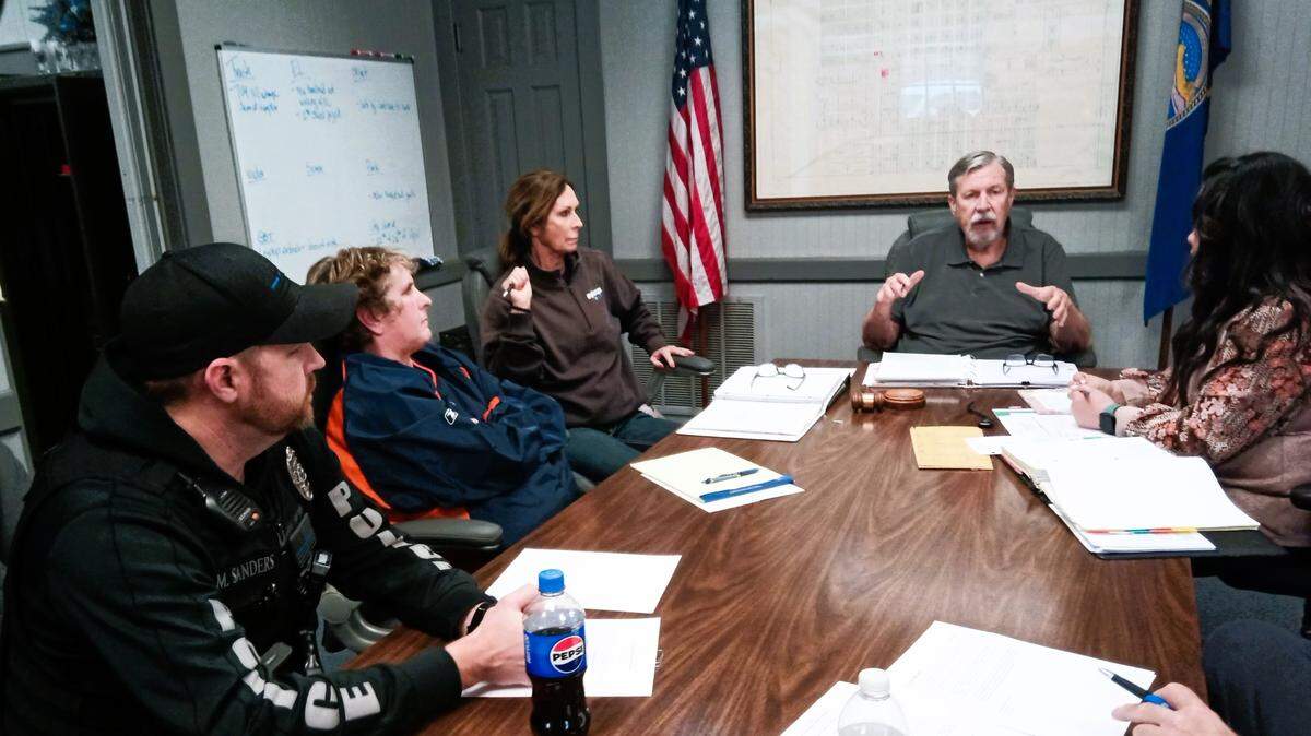 Members of the St. John Zoning Board discuss whether to give a zoning variance to Mike Rosseau and Dorothy Tobe to allow them to live in a former church building they own in the city’s commercial district. From left to right are St. John Police Officer Mike Sanders, salon owner Jeni Jones, former Mayor Jill Stimatze, board Chairman Dennis Veatch and City Clerk and Zoning Administrator Pam Watson.