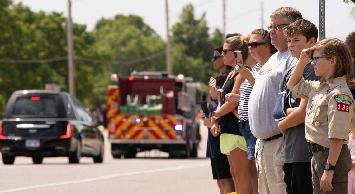 Folks lined the street during the procession for Wichita firefighter Ty Voth at the intersection Maple and 119th St.
