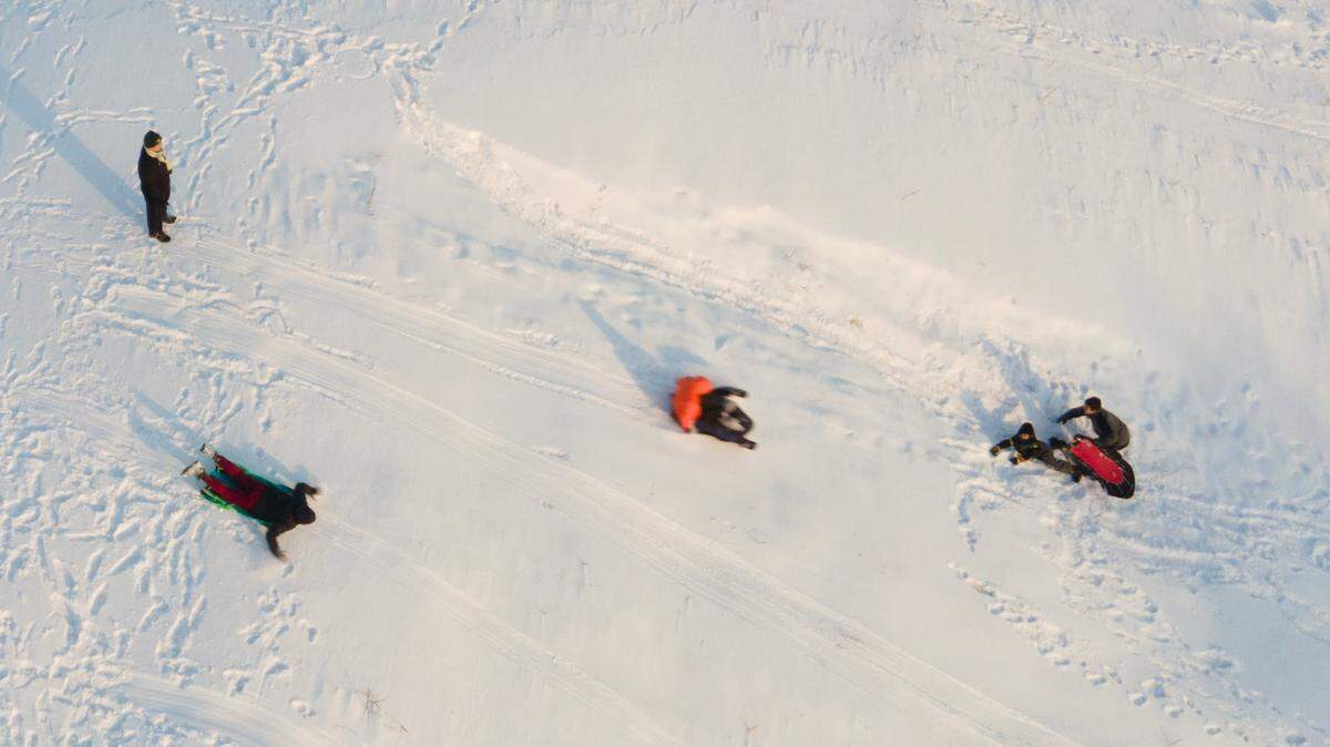 These sledders at Sedgwick County Park enjoyed the fresh snow early Friday morning. About 6 inches of snow fell on Wichita late Thursday evening.