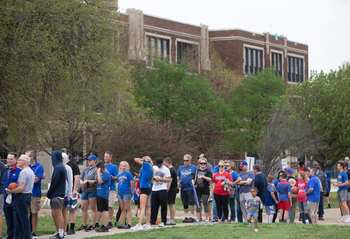 The line to meet University of Kansas basketball players snaked around East High School on Saturday. Wichita was the first stop of the state-wide barnstorming tour for the Kansas men’s basketball national championship team. Because of recent NCAA policy changes, all 18 players on the 2021-22 KU team - not just the graduating seniors - were eligible to participate on the tour. (April 23, 2022)