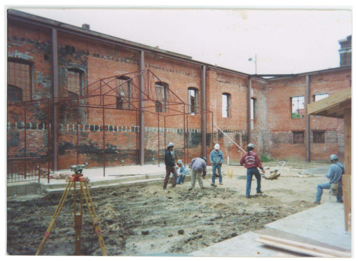 A photo shows the interior of The Brickyard before Mark and Joni Russell opened in in the late 1990s as a live music venue.