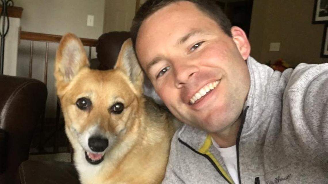 KWCH chief meteorologist Ross Janssen poses with his pet, Millie the Weather Dog.