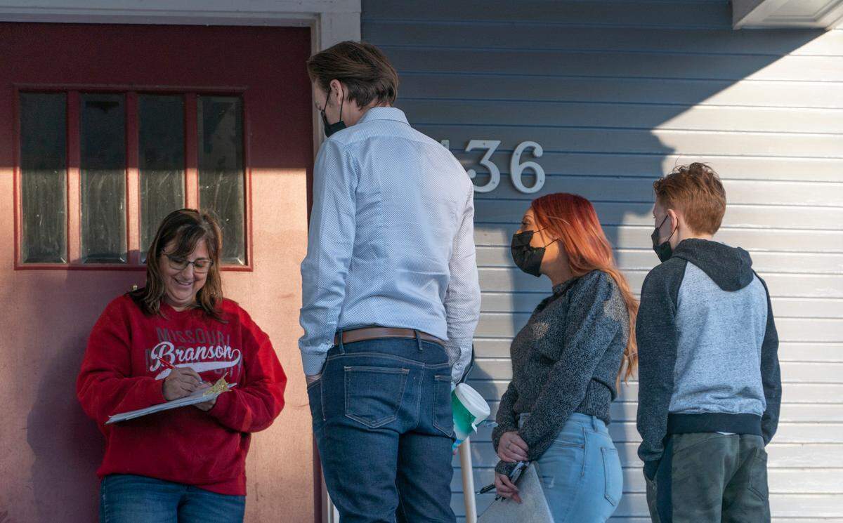 College Hill resident Laura Murphy signs a petition asking the Andy’s Frozen Custard franchisee to reconsider moving to College Hill. Aimee McCaffree, along with her son Sylias McCaffree and her husband Stephen Holt have launched a Facebook page, petition drive and door-to-door campaign aimed at getting t. McCaffree believes that a franchise restaurant does not belong in the eclectic neighborhood full of locally owned eateries and shops, (March 1, 2021)