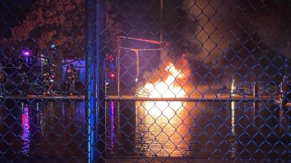 Vandals used a grinder to cut through the chain that locked Aley Pool early Wednesday morning and then set fire to about 30 chairs and sun shades, city officials said.