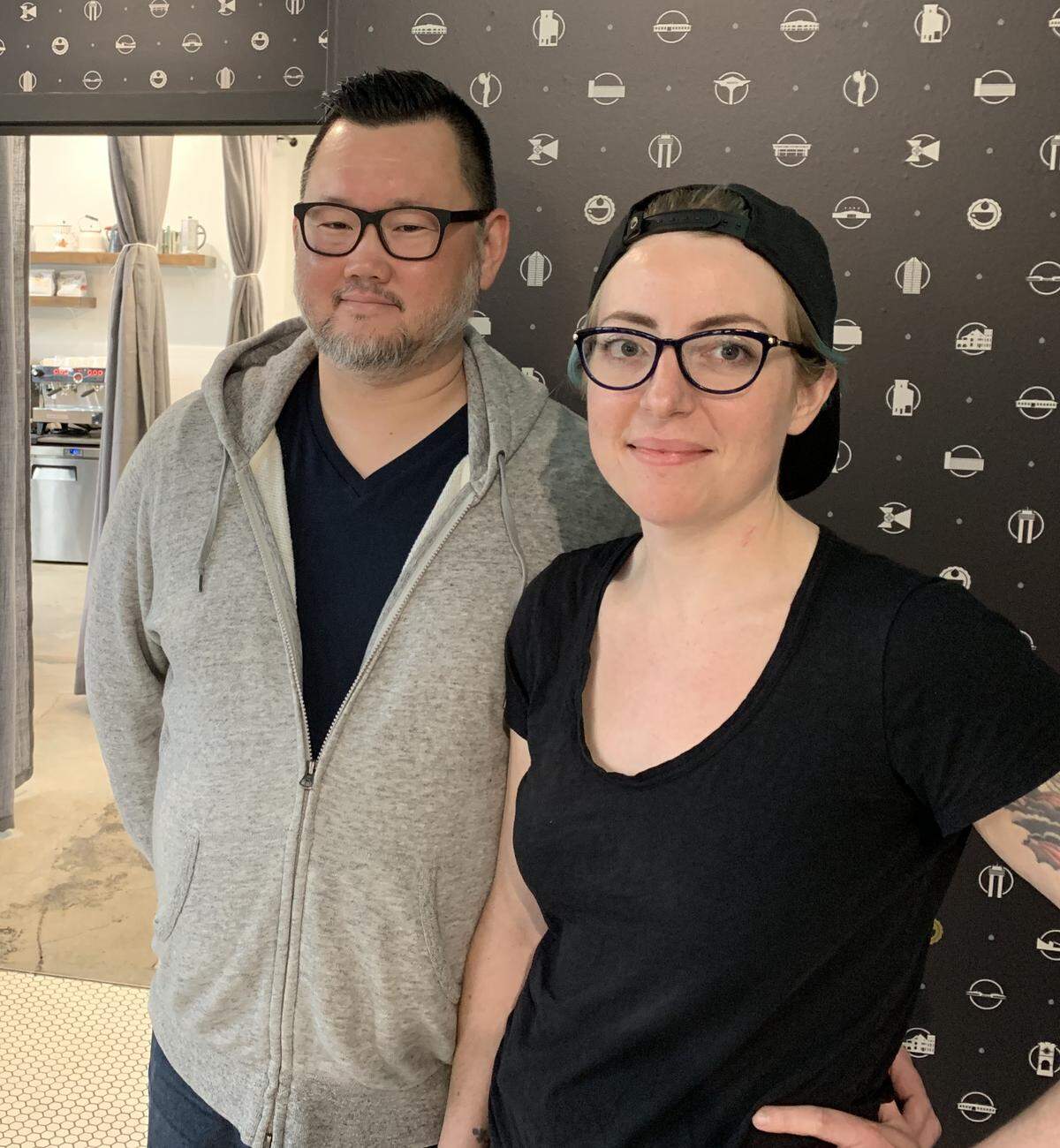 Leslie Coffee Co. owner Sarah Leslie, right, and her husband, Frank Kolodziej, came up with a unique wallpaper for the shop.