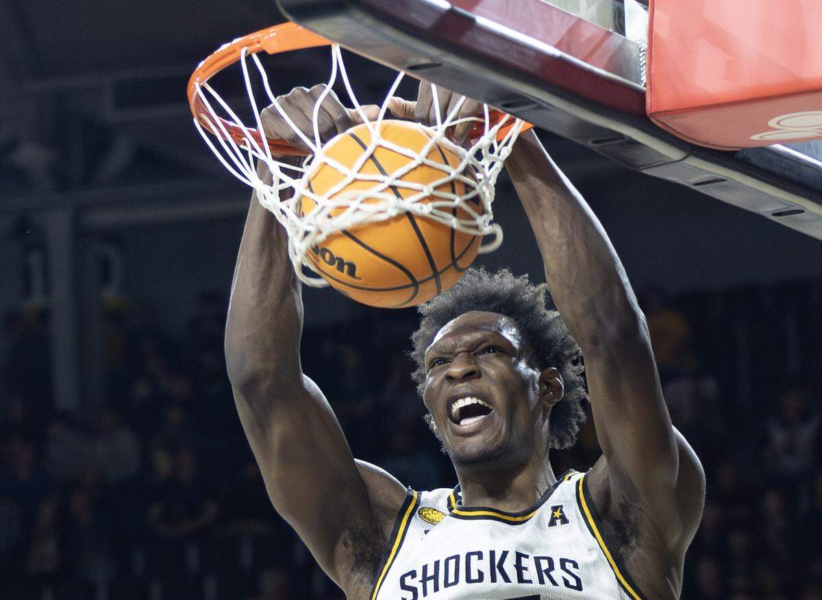 Wichita State’s Quincy Ballard dunks the ball during the second half against Tulsa on Sunday at Koch Arena.