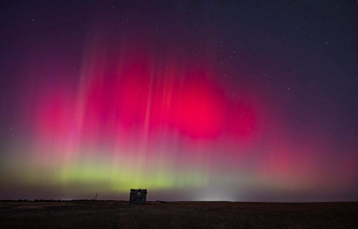 The northern lights can be seen above a dilapidated farmhouse near Marquette on Thursday night. The lights are caused by an interaction between the earth’s magnetic field and charged particles released by the sun.