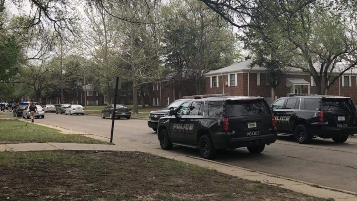 Wichita police investigate a reported shooting near Oliver and Harry on Wednesday.