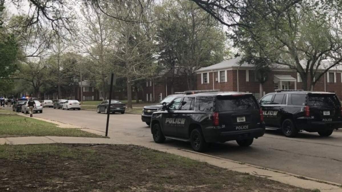 Wichita police investigate a reported shooting near Oliver and Harry on Wednesday.