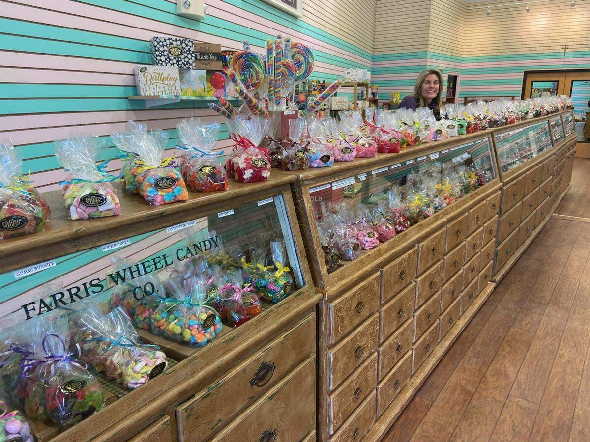 Gerika Wulf, shown here, was skeptical when she was told her Farris Wheel Candy Co. was nominated as one of the country’s top candy stores, but it ended up being named the eighth best on a USA Today poll.