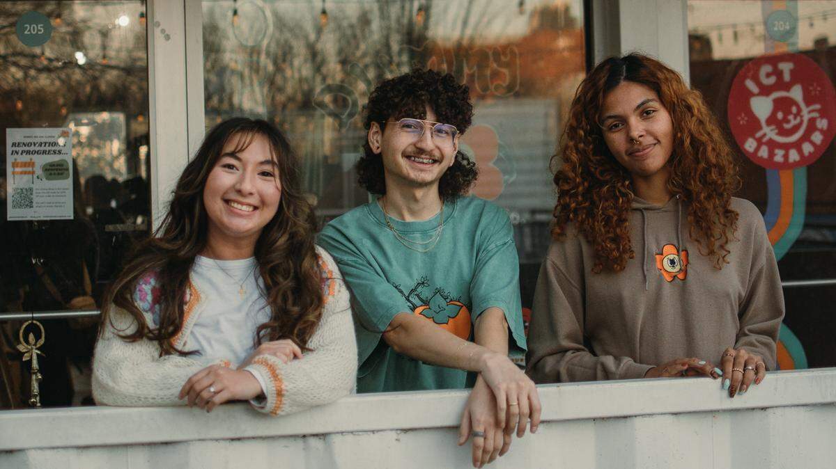 Dummy Apparel Company owner Danny Sun, center, and his sister and store manager, Megan Patterson, left, and assistant manager, Katrina Avery, right.