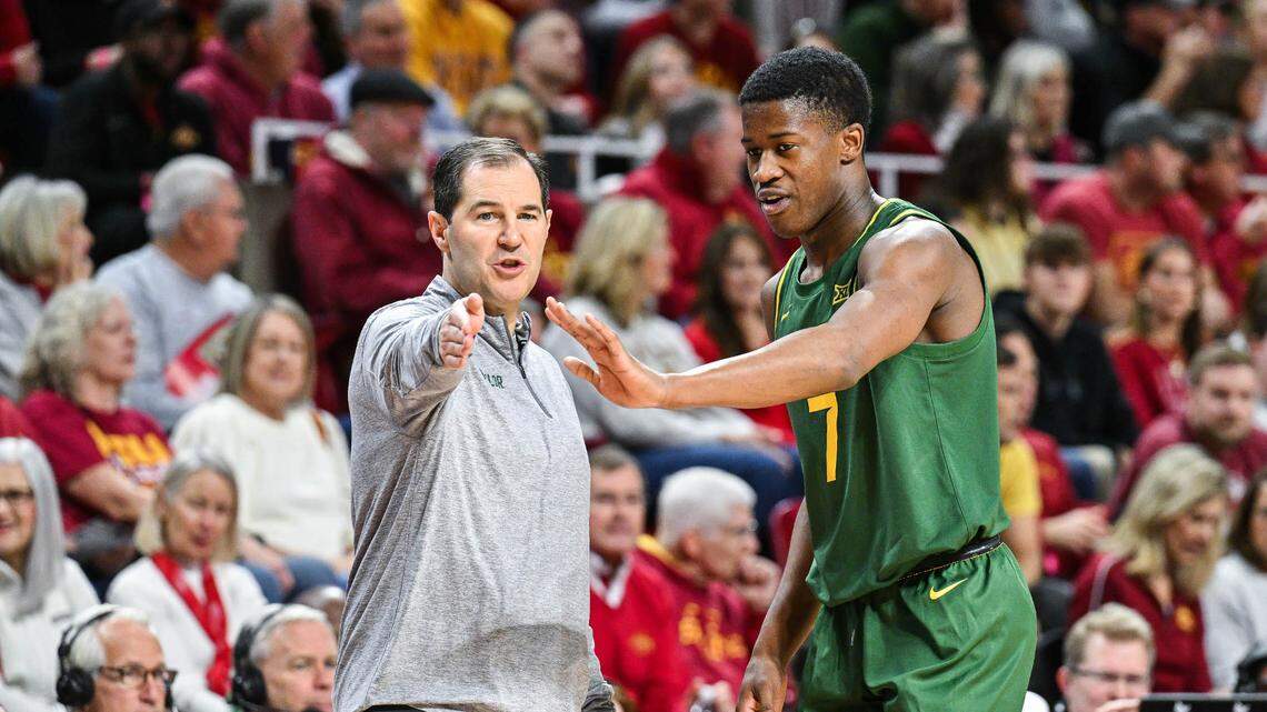 Baylor Bears head coach Scott Drew and guard VJ Edgecombe (7) talk during a timeout against the Iowa State Cyclones during the first half at James H. Hilton Coliseum.