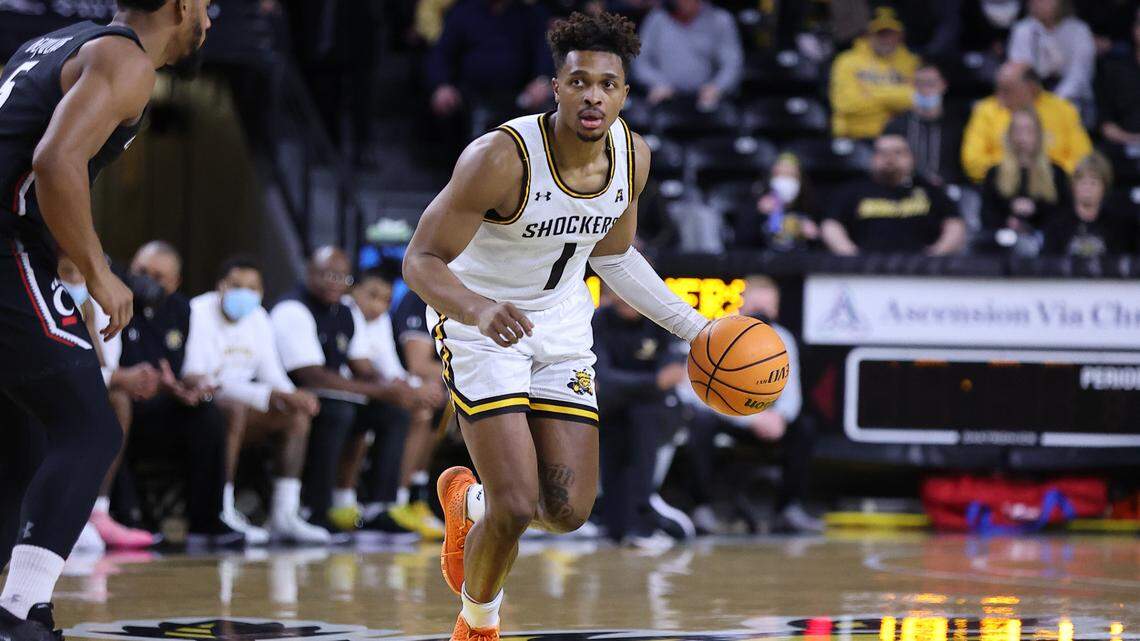 Wichita State’s Tyson Etienne looks to make a pass in the first half against Cincinnati in Sunday’s game at Koch Arena.