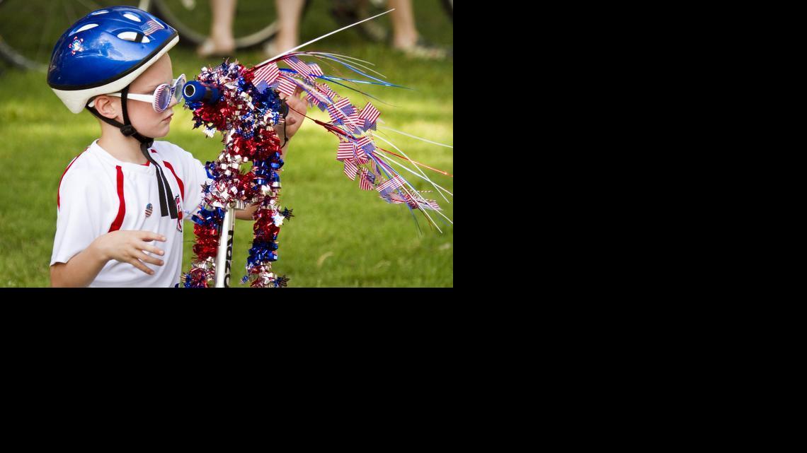 Josh Jonker readies his ride for the parade of bikes, wagons and scooters decorated for the annual Riverside Citizens Association Fourth of July Pancake Breakfast and Children’s Parade in Central Riverside Park in 2012.

